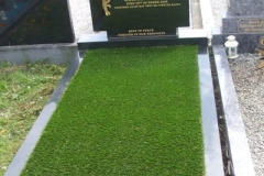 Grave with sand & artficial grass after