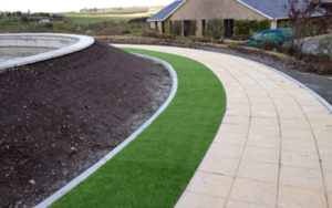 artificial grass verge alongside footpath